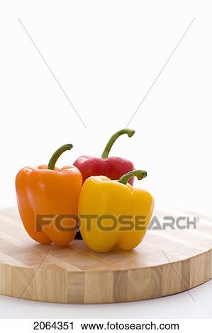 Yellow, Orange And Red Peppers On Butcher Block Cutting Board View Large Photo Image Stock Image - Yellow, Orange And Red Peppers On Butcher Block Cutting Board. Fotosearch