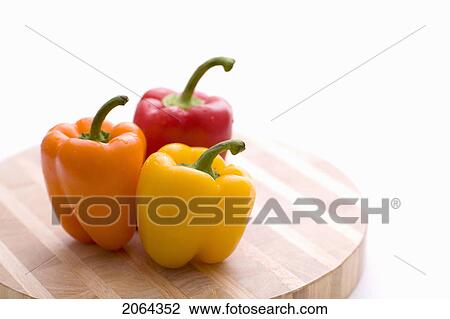 Yellow, Orange And Red Peppers On Butcher Block Cutting Board View Large Photo Image Stock Image - Yellow, Orange And Red Peppers On Butcher Block Cutting Board. Fotosearch