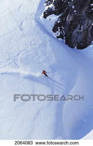 Stock Image - Young Man Skiing On Ungroomed Slope Near Fortress Mountain, Alberta, Canada.. Fotosearch