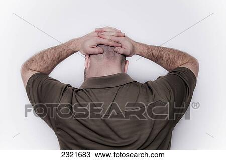 Young Man With Hands And Fingers Entwined Over The Back Of His Head; Connecticut United States Of America View Large Photo Image Stock Image - Young Man With Hands And Fingers Entwined Over The Back Of His Head; Connecticut United States Of America. Fotosearch