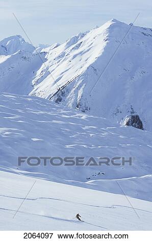 Young Woman Skiing Fresh Powder At Mica Heliskiing, Mica Creek, British Columbia, Canada View Large Photo Image Stock Photo - Young Woman Skiing Fresh Powder At Mica Heliskiing, Mica Creek, British Columbia, Canada. Fotosearch