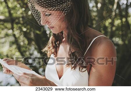 A bride reading from a piece of paper; Kirkland, Washington, United States of America View Large Photo Image Stock Photo - A bride reading from a piece of paper; Kirkland, Washington, United States of America. Fotosearch