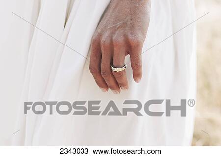 Stock Image - A bride's hand with a wedding ring; Kirkland, Washington, United States of America. Fotosearch