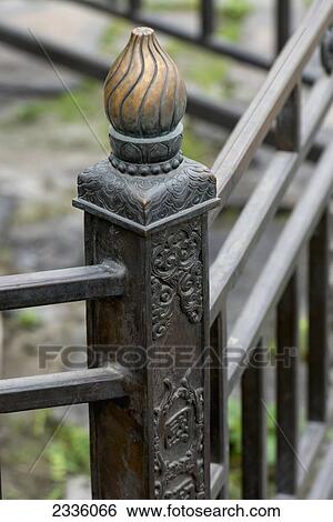 A decorative baluster on a metal railing View Large Photo Image Stock Photograph - A decorative baluster on a metal railing. Fotosearch