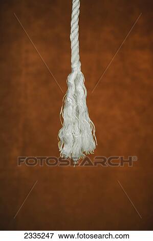 A frayed rope against a brown background View Large Photo Image Stock Photo - A frayed rope against a brown background. Fotosearch