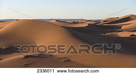 Stock Image - A landscape of drifting sand. Fotosearch
