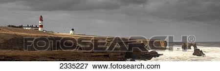 A lighthouse and cliffs along the coastline; South Shields, Tyne and Wear, England View Large Photo Image Stock Photo - A lighthouse and cliffs along the coastline; South Shields, Tyne and Wear, England. Fotosearch