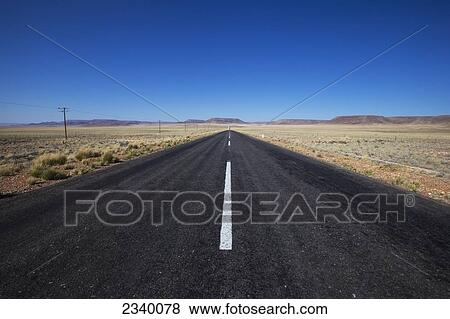 A paved road in a rural area with blue sky; Namibia View Large Photo Image Stock Photo - A paved road in a rural area with blue sky; Namibia. Fotosearch