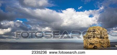 Stock Photograph - A rock formation in the River Tyne; South Shields, Tyne and Wear, England. Fotosearch