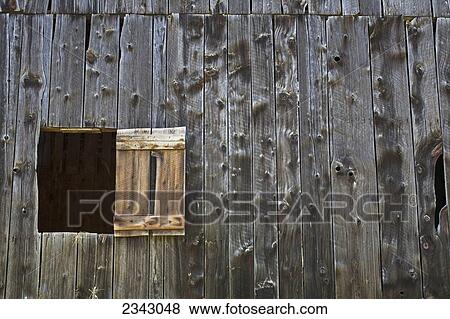 A small window open along a wooden wall; Ville de Lac Brome, Quebec, Canada View Large Photo Image Stock Photo - A small window open along a wooden wall; Ville de Lac Brome, Quebec, Canada. Fotosearch