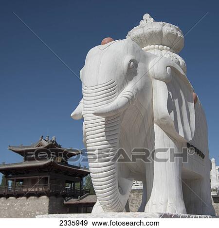 A white carved elephant statue against blue sky View Large Photo Image Stock Photo - A white carved elephant statue against blue sky. Fotosearch