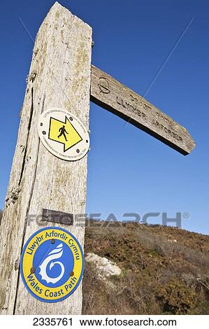A wooden post and directional sign for a Wales Coast Path; Wales View Large Photo Image Stock Image - A wooden post and directional sign for a Wales Coast Path; Wales. Fotosearch