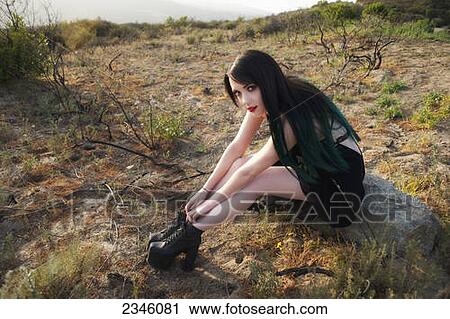 A young woman with black and green long hair posing in an outdoor environment; California, United States of America View Large Photo Image Stock Image - A young woman with black and green long hair posing in an outdoor environment; California, United States of America. Fotosearch