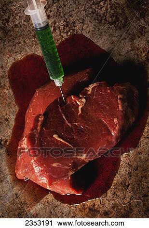 Stock Image - Antibiotic and hormone use in the factory farming industry; Spruce Grove, Alberta, Canada. Fotosearch