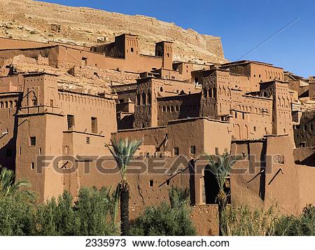 Brown buildings built on a hillside and a blue sky View Large Photo Image Stock Image - Brown buildings built on a hillside and a blue sky. Fotosearch