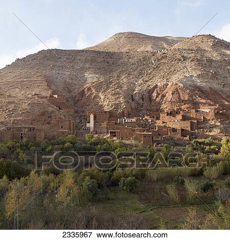 Buildings at the foot of a mountain View Large Photo Image Stock Photo - Buildings at the foot of a mountain. Fotosearch