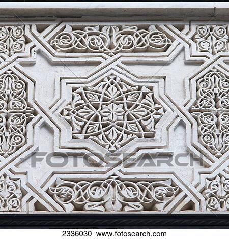 Stock Image - Carved ornate pattern on a white wall. Fotosearch