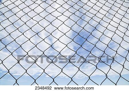 Chain link fence and blue sky with cloud; Canada View Large Photo Image Stock Image - Chain link fence and blue sky with cloud; Canada. Fotosearch