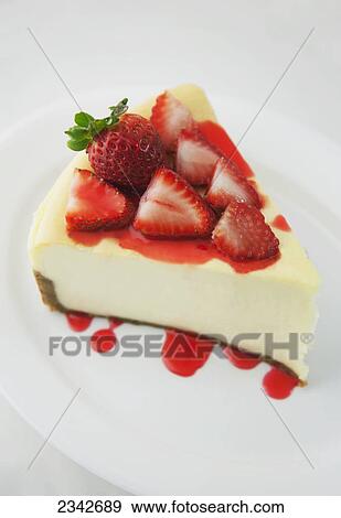 Stock Photo - Cheesecake topped with strawberries; Oahu, Hawaii, United States of America. Fotosearch