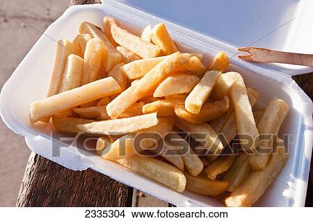 Chips bought from a Fish and Chips kiosk at West Bay, on the Jurassic Coast; Dorset, England View Large Photo Image Picture - Chips bought from a Fish and Chips kiosk at West Bay, on the Jurassic Coast; Dorset, England. Fotosearch