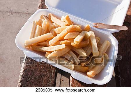 Stock Photography - Chips bought from a Fish and Chips kiosk at West Bay, on the Jurassic Coast; Dorset, England. Fotosearch