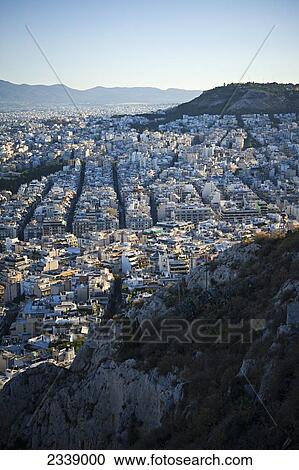 Stock Image - Cityscape view of Athens at sunrise; Athens, Greece. Fotosearch