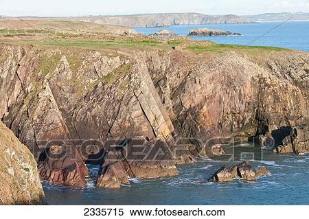 Cliffs along the coastline View Large Photo Image Stock Photography - Cliffs along the coastline. Fotosearch