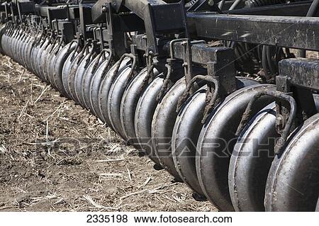 Close up of a series of rollers on an air seeder; Alberta, Canada View Large Photo Image Stock Photo - Close up of a series of rollers on an air seeder; Alberta, Canada. Fotosearch