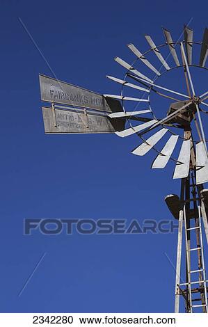 Close up of a windmill against a blue sky; Klein-Aus Vista, Namibia View Large Photo Image Stock Image - Close up of a windmill against a blue sky; Klein-Aus Vista, Namibia. Fotosearch