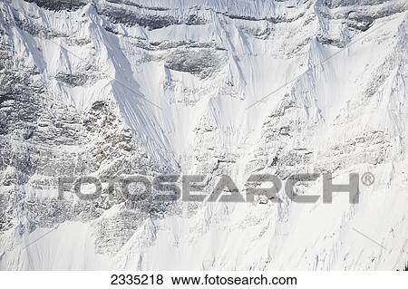 Close up of snow covered mountain face; Kananaskis Country, Alberta, Canada View Large Photo Image Stock Photo - Close up of snow covered mountain face; Kananaskis Country, Alberta, Canada. Fotosearch