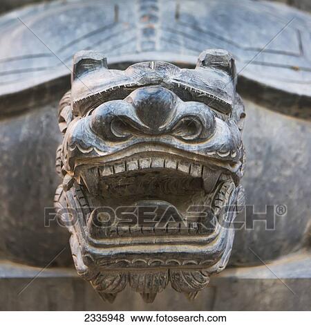 Close up of the head of a carved stone animal looking fierce showing teeth View Large Photo Image Stock Photo - Close up of the head of a carved stone animal looking fierce showing teeth. Fotosearch