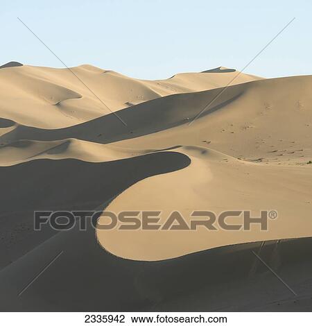 Desert landscape of sand slopes and ridges View Large Photo Image Stock Image - Desert landscape of sand slopes and ridges. Fotosearch