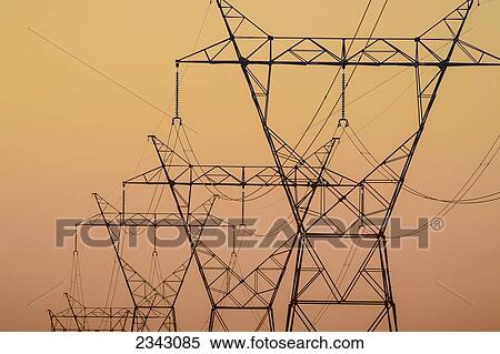 Stock Photography - Electrical transmission towers at sunset; Ohio, United States of America. Fotosearch