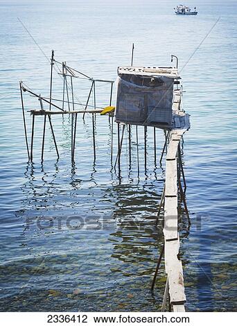 Fisherman's jetty and fishing boat on the shore of the Marmara Sea, near Sarkoy; Tekirdag Province, Turkey View Large Photo Image Stock Image - Fisherman's jetty and fishing boat on the shore of the Marmara Sea, near Sarkoy; Tekirdag Province, Turkey. Fotosearch