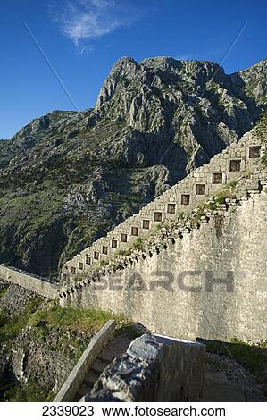 Stock Image - Fortress of St. Ivan wall with Mt. Lovcen in background; Kotor, Monte. Fotosearch