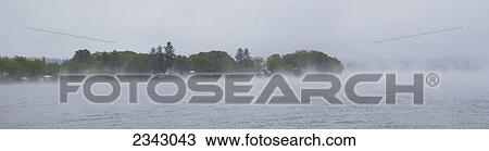 Late spring snowfall and trees along the shoreline; Ville de Lac Brome, Quebec, Canada View Large Photo Image Stock Image - Late spring snowfall and trees along the shoreline; Ville de Lac Brome, Quebec, Canada. Fotosearch