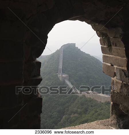 Stock Photograph - Looking out a window at the Great Wall of China; Beijing, China. Fotosearch