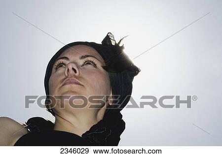 Stock Photo - Low angle portrait of a woman; Locarno, Ticino, Switzerland. Fotosearch