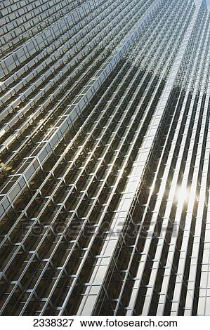 Stock Photo - Low angle view of a gold glass building with a sunburst reflecting; Toronto, Ontario, Canada. Fotosearch