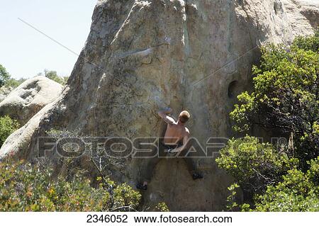 Man rock climbing (bouldering) at Lizard's Mouth; Santa Barbara, California, United States of America View Large Photo Image Stock Image - Man rock climbing (bouldering) at Lizard's Mouth; Santa Barbara, California, United States of America. Fotosearch