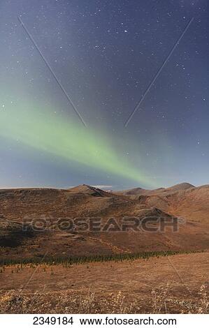 Picture - Northern Lights above Eagle Summit and Pinelle Mountain Range along the Steese Highway, North of Fairbanks; Alaska, United States of America. Fotosearch