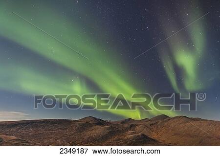 Stock Photo - Northern Lights above Eagle Summit and Pinelle Mountain Range along the Steese Highway, North of Fairbanks; Alaska, United States of America. Fotosearch