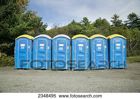 Stock Photography - Portable toilets in rural setting; Canada. Fotosearch