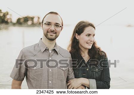 Stock Photography - Portrait of a couple; Crescent Beach, British Columbia, Canada. Fotosearch
