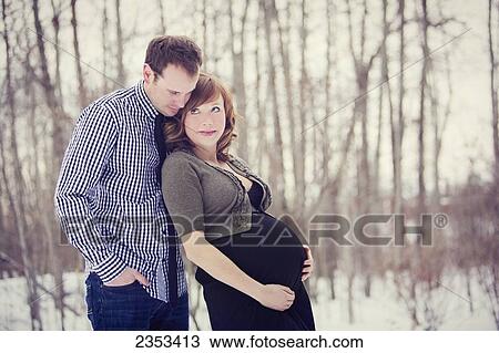 Portrait of a couple during pregnancy; Edmonton, Alberta, Canada View Large Photo Image Stock Image - Portrait of a couple during pregnancy; Edmonton, Alberta, Canada. Fotosearch