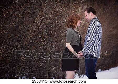 Portrait of a couple during pregnancy; Edmonton, Alberta, Canada View Large Photo Image Stock Photography - Portrait of a couple during pregnancy; Edmonton, Alberta, Canada. Fotosearch