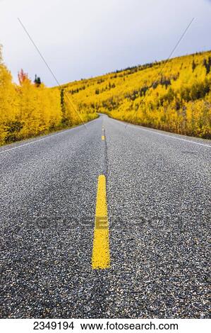 Picture - Road detail traveling the Steese Highway North of Fairbanks in autumn; Fairbanks, Alaska, United States of America. Fotosearch