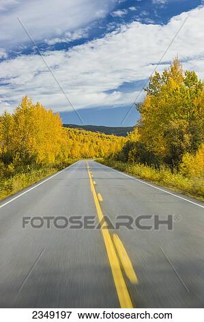 Stock Photo - Road detail traveling the Steese Highway North of Fairbanks in autumn; Fairbanks, Alaska, United States of America. Fotosearch