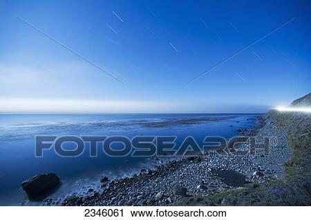 Seascape of the Pacific Ocean with star trails in the sky; Big Sur, California, United States of America View Large Photo Image Stock Image - Seascape of the Pacific Ocean with star trails in the sky; Big Sur, California, United States of America. Fotosearch