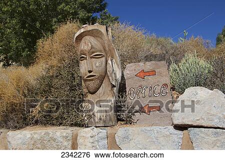 Sign for the office with a wooden carved face; Klein-Aus Vista, Namibia View Large Photo Image Stock Photograph - Sign for the office with a wooden carved face; Klein-Aus Vista, Namibia. Fotosearch